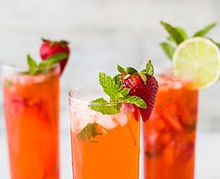 Kombucha drink in glass with strawberry
